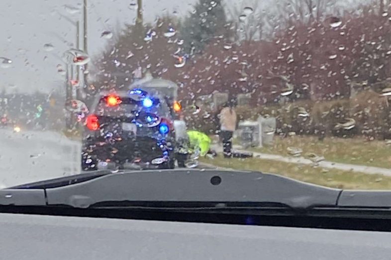 Guelph Police Officer Helping Citizen